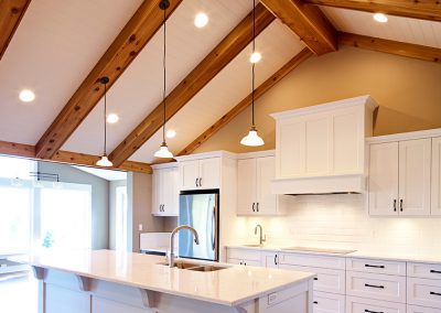 Faux beams in great room to give these custom home clients the look of timber framing without the cost.