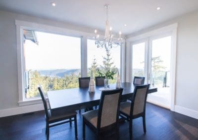 Dining area with large windows and view of Cowichan Valley