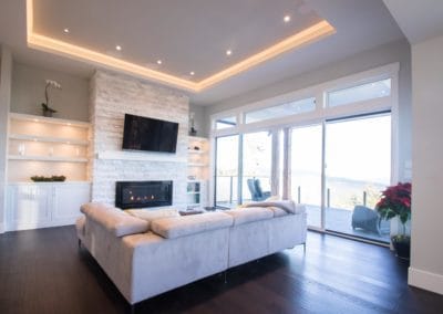 Living area with built in bookcases and feature fireplace