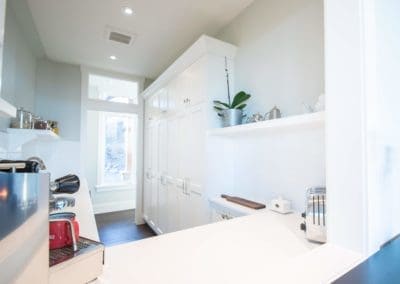 Room with cabinetry and countertops in goldstream heights custom home