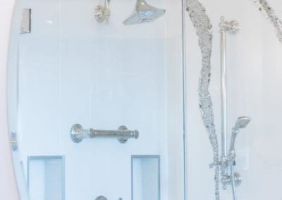 Close up of mirror reflecting custom built shower in bathroom