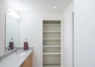 Long bathroom counter in Bare Point Custom Home