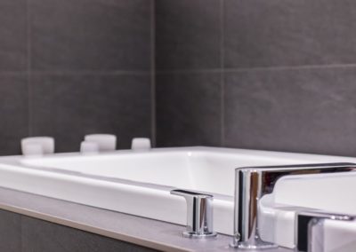 Close up of bathtub in bathroom custom home