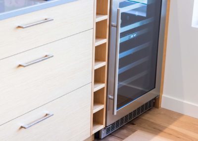 Wine fridge in custom home dining room