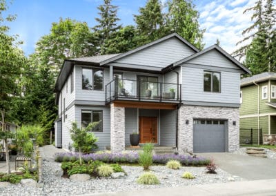 Driftwood Custom Home side angle of front exterior stone and Hardie siding