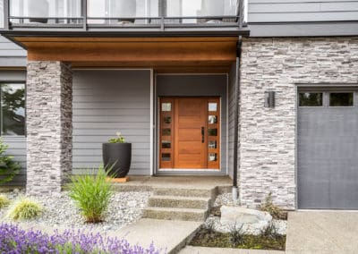 Driftwood Custom Home front door and wood soffit for front porch