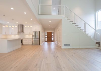 kitchen, living room and front entry driftwood custom home