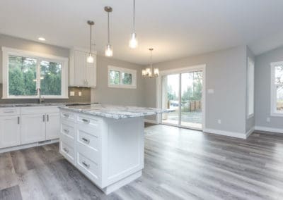 Kitchen looking into dining room with sliding glass doors