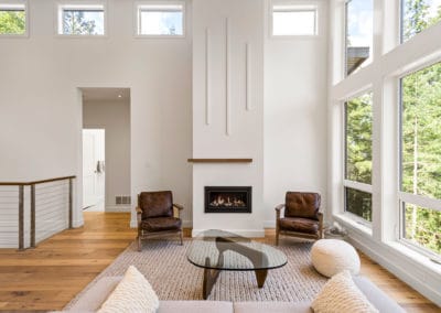 Fireplace in living room with vaulted ceilings