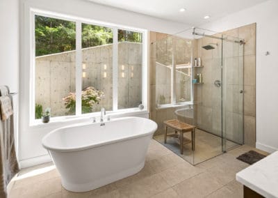 soaker freestanding tub and walk-in shower in master bathroom