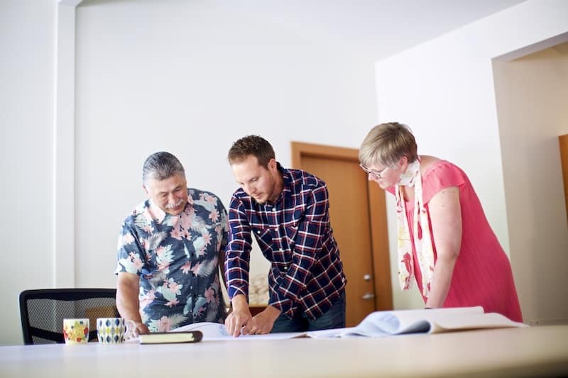 Group looking over home drawings