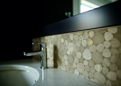 close up of custom backsplash in bathroom