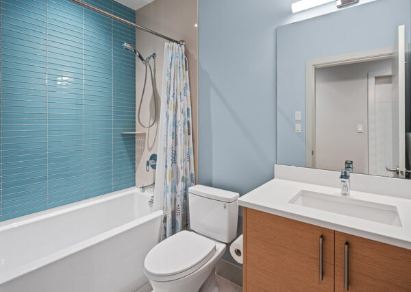 Guest bathroom with blue accents custom home