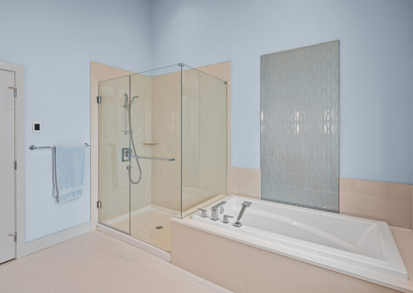 Beige tile in master bathroom ensuite