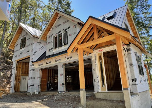 timber frame front entrance on custom carriage home
