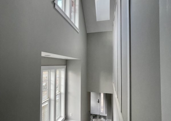 staircase with skylight in carriage house