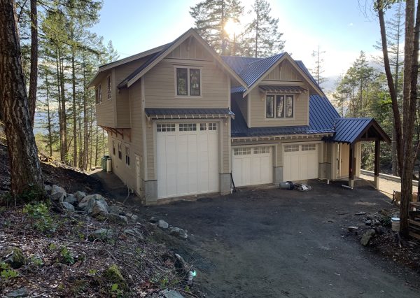 Exterior of custom carriage home with oversized garage for rv storage