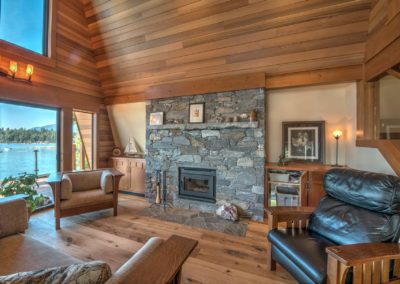 fireplace and wooden shiplap a-frame home