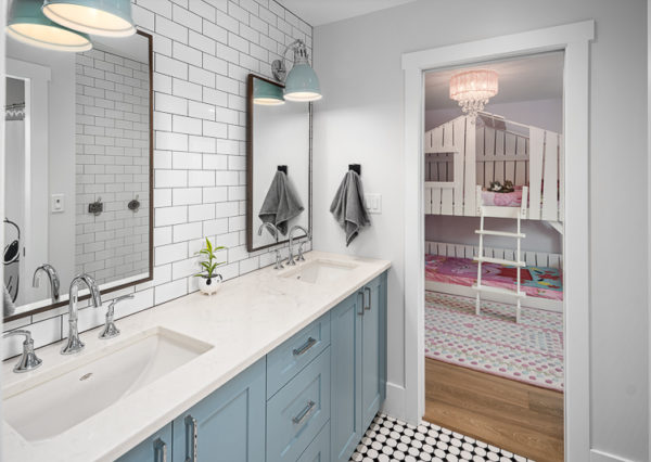 Jack and Jill bathroom with blue vanity