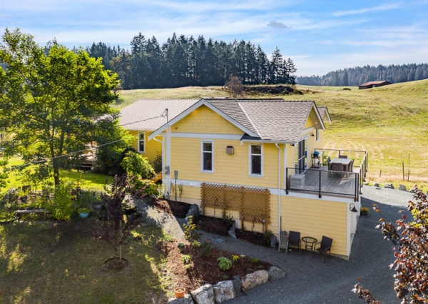 Side exterior of yellow house