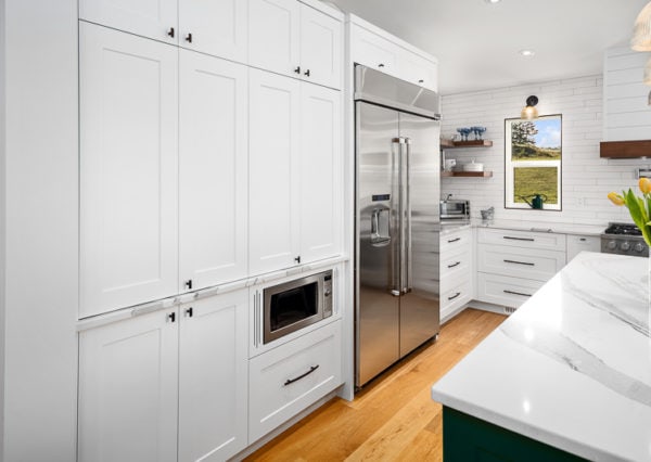 Custom cabinetry and built in appliances in kitchen renovation