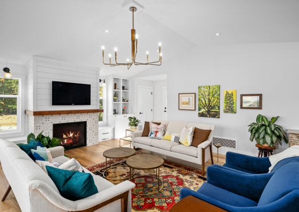 Living area with chandelier and accent gas fireplace