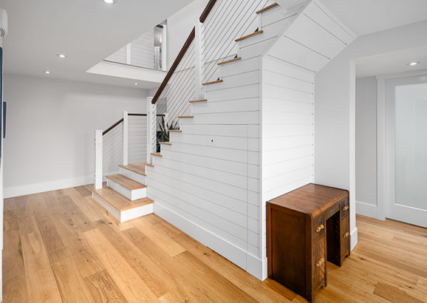 Staircase with cable railings and shiplap