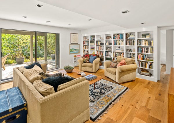 Family room with built-in bookcases and walk-out patio