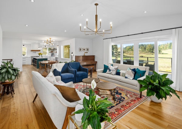 Open concept modern farmhouse living room, dining room and kitchen