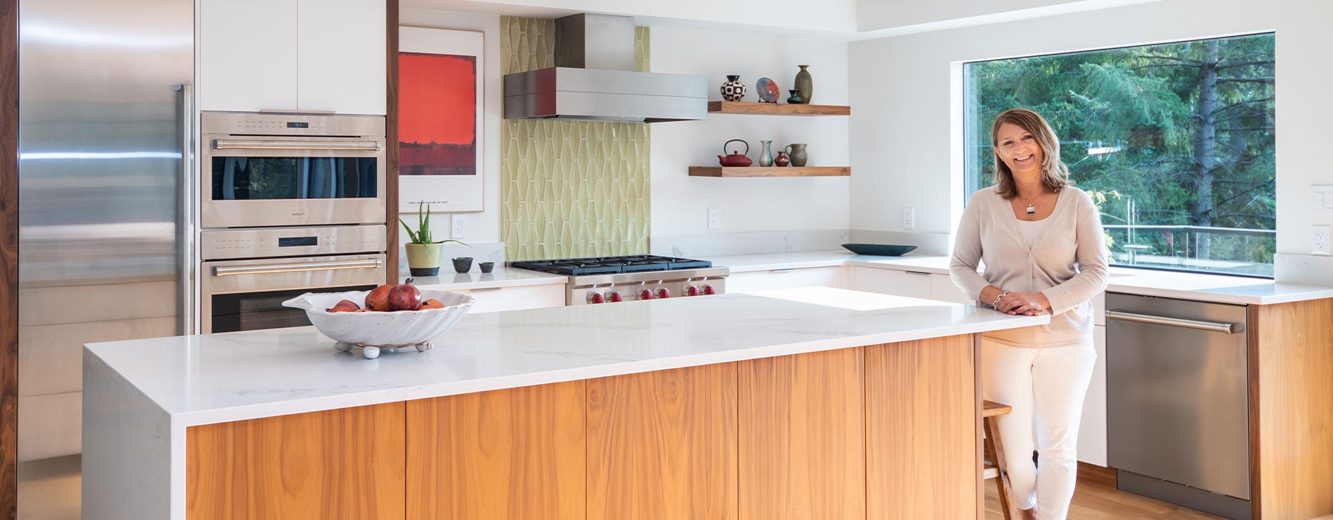 modern-revival-homeowner Modern 80s style kitchen renovation with smiling homeowner