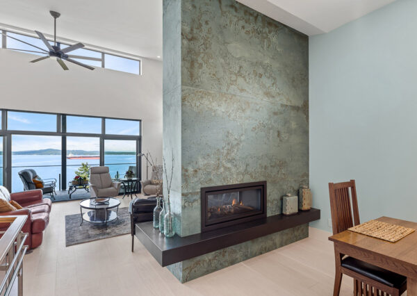 Custom tile work floor to ceiling fireplace