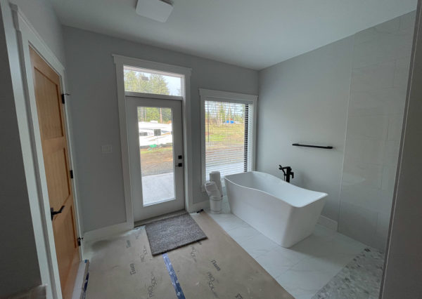 Bathroom with exterior door and window