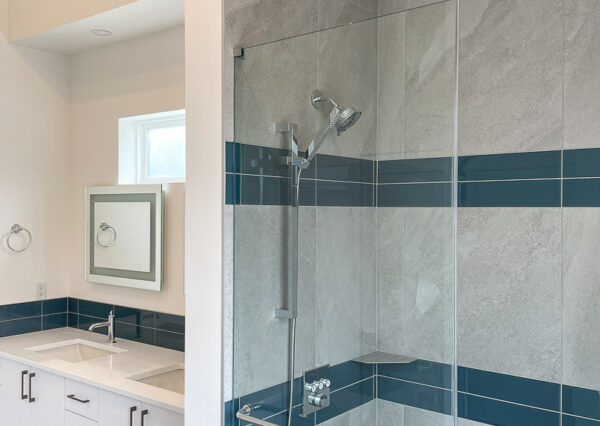 Walk-in tiled shower, glass, floating vanity