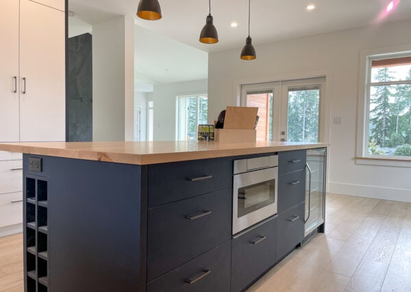 Built-in microwave and beverage cooler in kitchen island