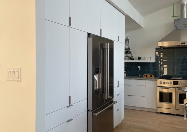 White kitchen cabinetry, hardwood floors