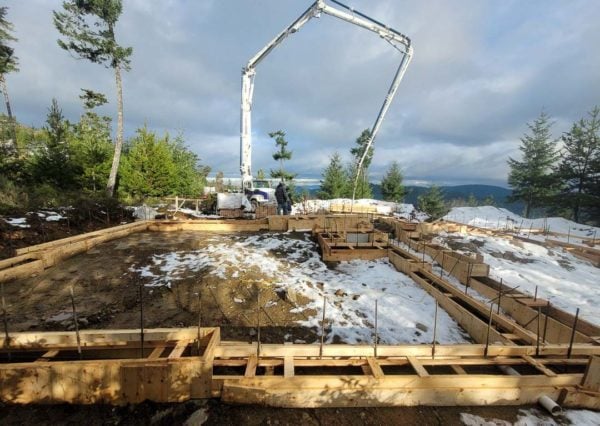 Footings being poured at under construction site