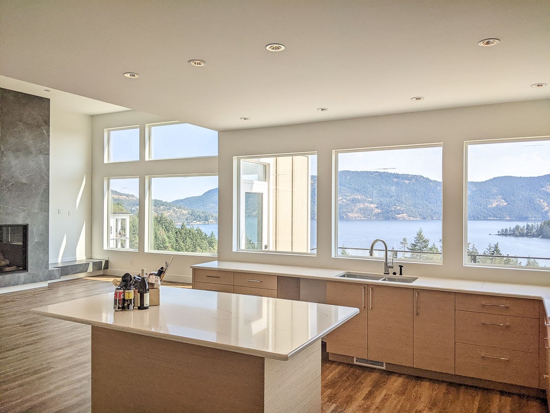 Kitchen facing ocean views in Cowichan Valley home