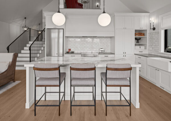 White kitchen cupboards, vaulted ceiling, quartz countertops