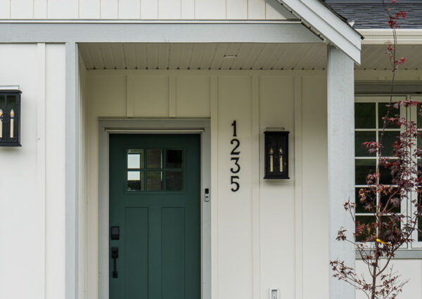 green front door, beige and gray exterior