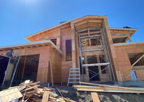 Front exterior under construction custom home framing