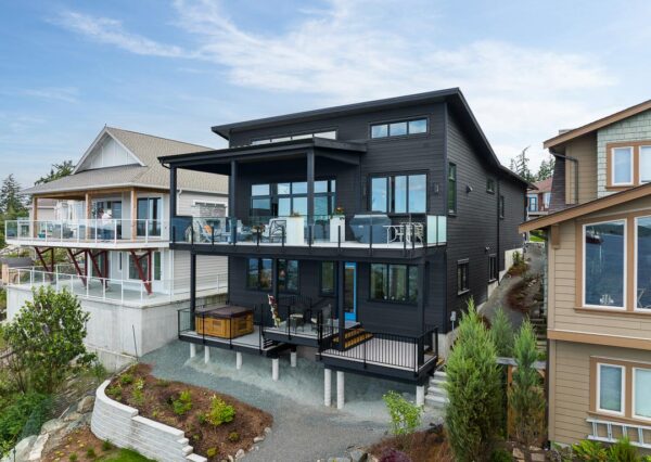 balck custom home exterior waterfront property