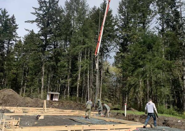 Footing being poured under construction home