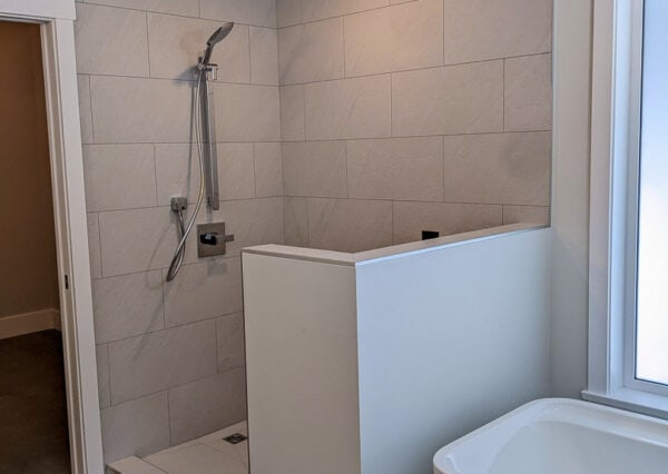 Walk-in shower with neutral tile