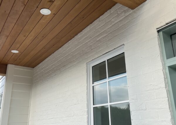 Cedar soffits and brick details at front porch.