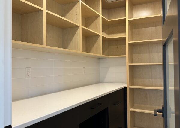 Walk in pantry with built in cabinetry in Shawnigan custom home