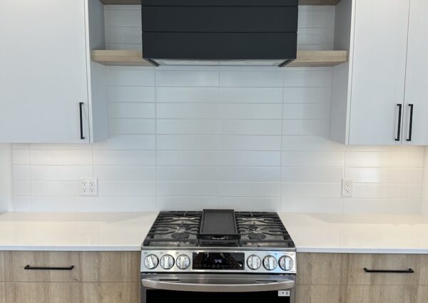 White and wood cabinetry with black shiplap custom kitchen design