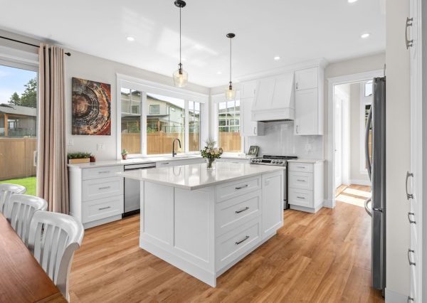 Large white kitchen design with island and lots of storage