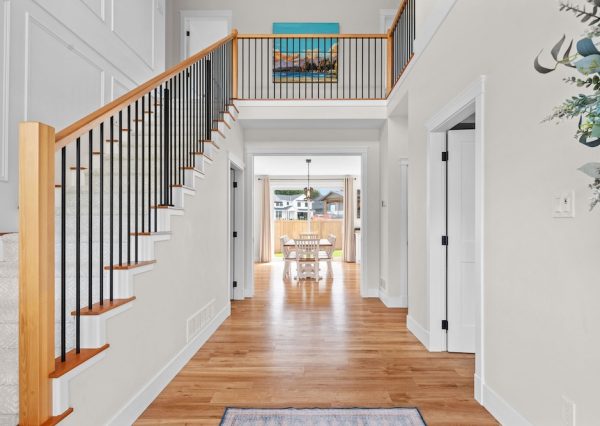 Front entrance into custom home with lots of natural light