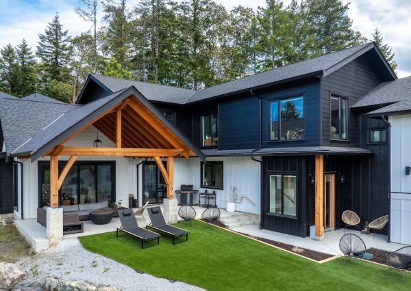 Custom designed home with timber framed patio