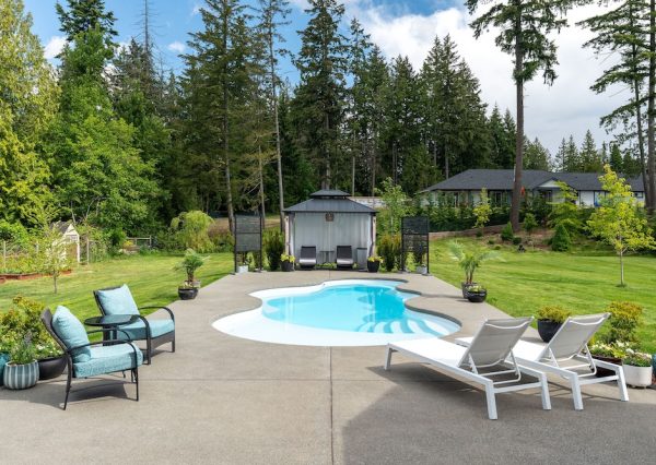 Swimming pool with seating areas on Vancouver Island